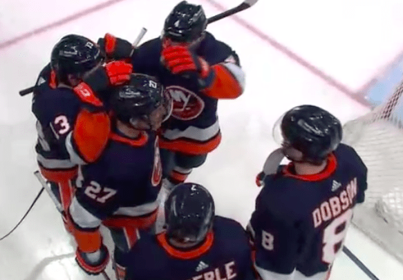 Islanders celebrate goal against sabres