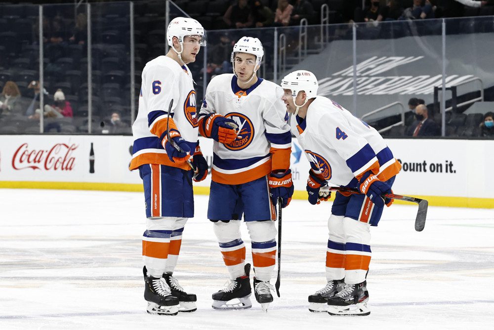 New York Islanders Ryan Pulock (6), center Jean-Gabriel Pageau (44) and defenseman Andy Greene (4) discuss a face off in the offensive zone