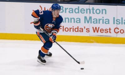 Casey Cizikas skates with the puck during the third period of the National Hockey League game between the Washington Capitals and the New York Islanders.
