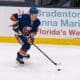 Casey Cizikas skates with the puck during the third period of the National Hockey League game between the Washington Capitals and the New York Islanders.