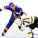 New York Islanders defenseman Scott Mayfield (24) fights with Boston Bruins left wing Taylor Hall (71) during the first period of the Stanley Cup Playoffs Second Round game 4