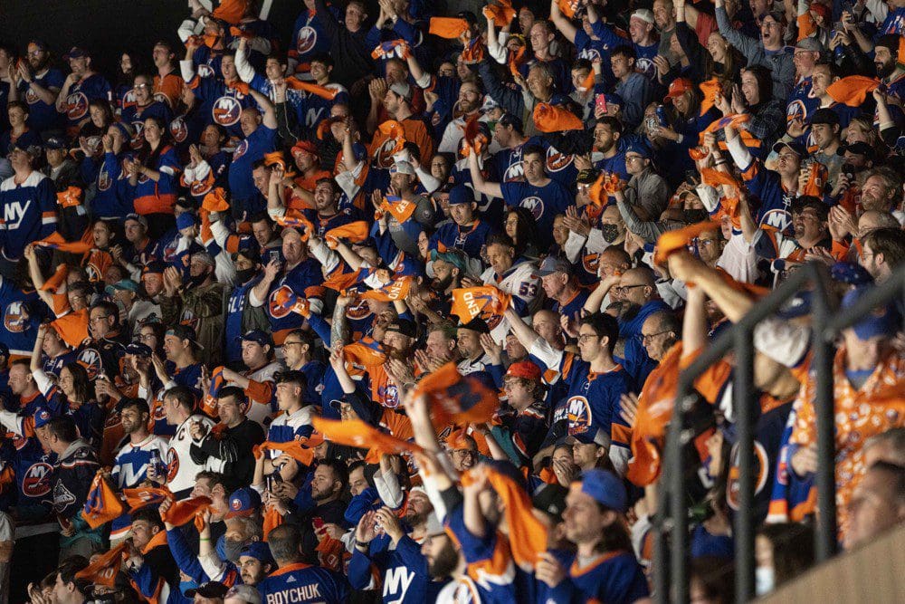 UNIONDALE, NY - JUNE 03: New York Islanders fans cheer during the third period of Game 3 of the NHL Stanley Cup Playoffs Second Round between the Boston Bruins and the New York Islanders on June 3, 2021, at the Nassau Coliseum in Uniondale, NY. (Photo by Gregory Fisher/Icon Sportswire)