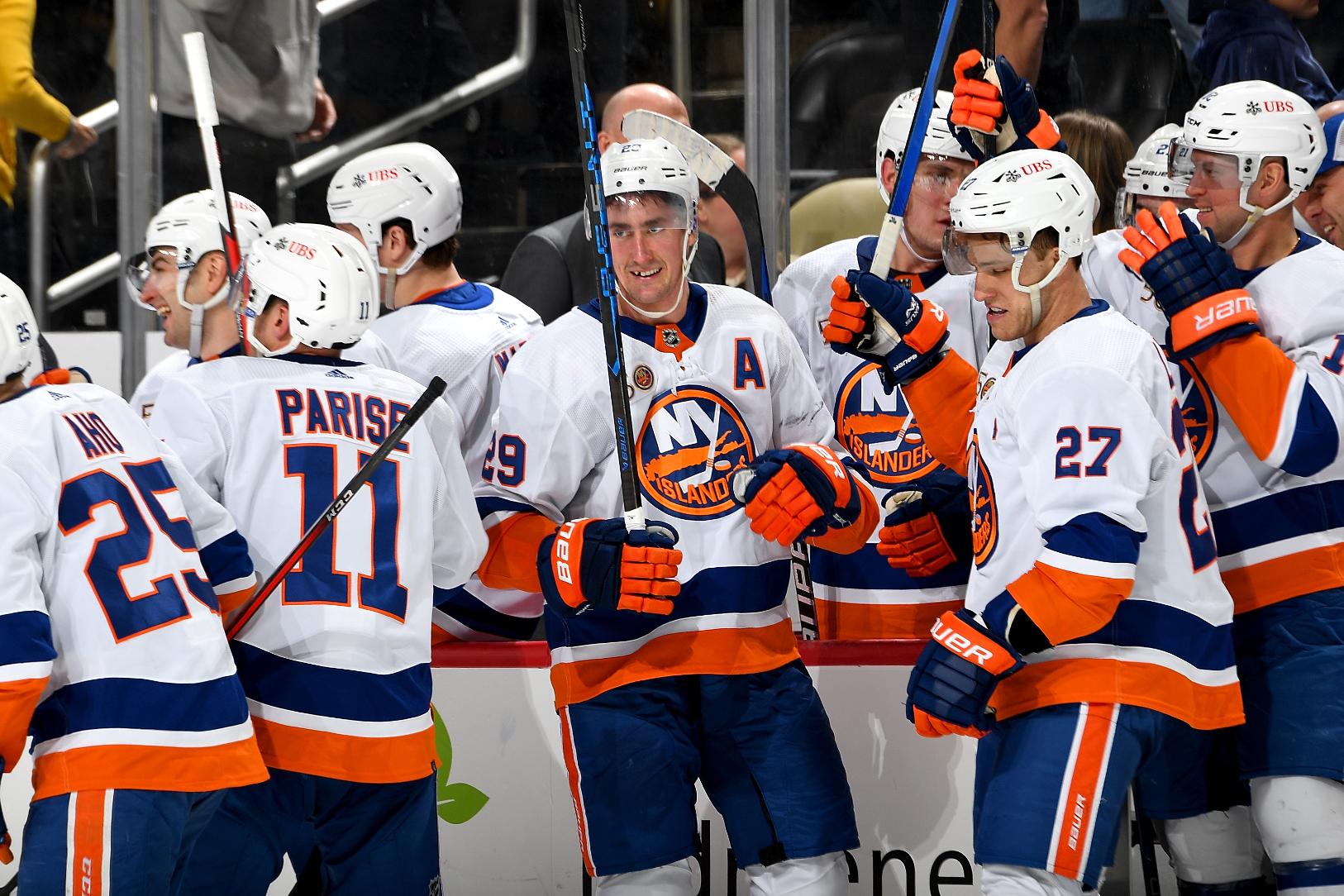 New York Islanders forward Brock Nelson and teammates celebrating after his overtime goal against the Penguins (Photo courtesy of New York Islanders website)